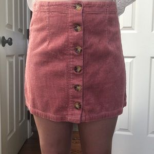 A pink skirt button down skirt